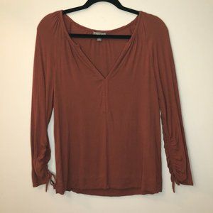Point Sur Drapey open v-neck blouse cinch sleeve.